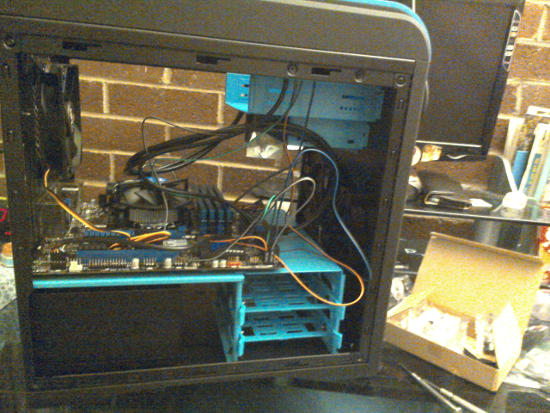 The motherboard lying in the middle of the case.