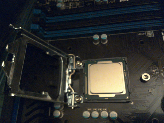 The motherboard's processor cover is off.