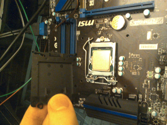 I am removing the back processor cover.
